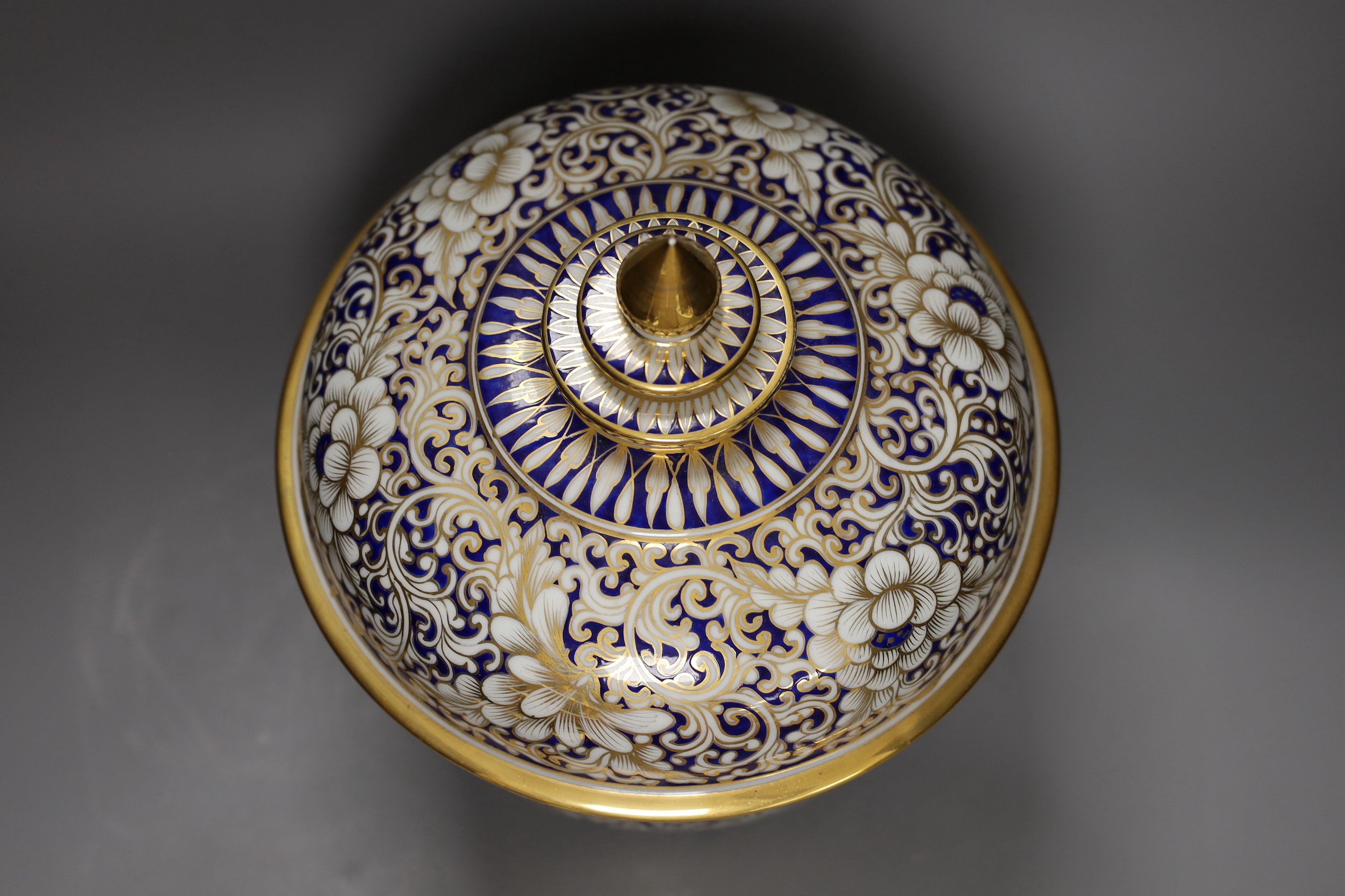 An ornate Continental porcelain bowl and cover, 29cm